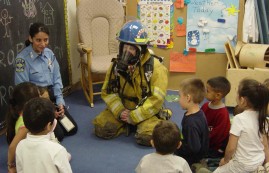 Kids getting a Firefighters Demonstration 