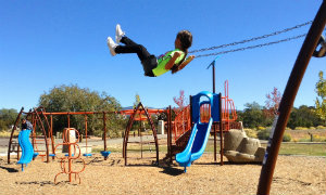Photo of child swinging at Villa Linda Park